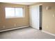 Bright bedroom with large window and closet with sliding doors at 875 S Quebec St # 25, Denver, CO 80247
