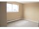 Bright and airy bedroom featuring plush carpeting, a window, and painted walls at 875 S Quebec St # 25, Denver, CO 80247