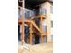 Apartment building showing stairways with black metal railings and balconies with exterior entrance doors at 875 S Quebec St # 25, Denver, CO 80247