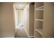 Neutral hallway featuring a coat closet and easy access to other rooms within the home at 875 S Quebec St # 25, Denver, CO 80247