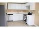 Open kitchen featuring stainless steel appliances, plenty of cabinet space and updated flooring at 875 S Quebec St # 25, Denver, CO 80247