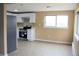 Spacious eat-in kitchen with stainless steel appliances and ample cabinet space at 875 S Quebec St # 25, Denver, CO 80247