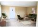 Cozy living room featuring stylish green furniture, an accent rug, and a decorative plant for a comfortable feel at 875 S Quebec St # 25, Denver, CO 80247