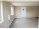 Open floor plan features a bright living room, neutral walls, wood flooring and large windows at 875 S Quebec St # 25, Denver, CO 80247