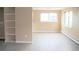 Spacious living room featuring built-in shelving and ample natural light at 875 S Quebec St # 25, Denver, CO 80247
