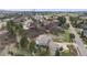 Estate aerial view revealing the home nestled in a lush, green neighborhood with mountain views at 6398 Lost Canyon Ranch Rd, Castle Rock, CO 80104