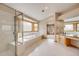 Bright bathroom with walk-in shower, jacuzzi tub and vanity area at 6398 Lost Canyon Ranch Rd, Castle Rock, CO 80104