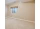 Bedroom with beige walls and neutral carpet and a single window at 6398 Lost Canyon Ranch Rd, Castle Rock, CO 80104