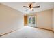 Bright bedroom with fan, carpet and private door to balcony, perfect for relaxing at 6398 Lost Canyon Ranch Rd, Castle Rock, CO 80104