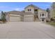 Stunning two-story home with stone accents, a three-car garage and grand entrance at 6398 Lost Canyon Ranch Rd, Castle Rock, CO 80104