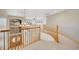 Open foyer featuring hardwood floors and a staircase with natural wood railings at 6398 Lost Canyon Ranch Rd, Castle Rock, CO 80104