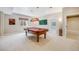 Spacious game room features a classic pool table under an elegant pendant lamp at 6398 Lost Canyon Ranch Rd, Castle Rock, CO 80104