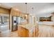 Open kitchen with granite countertops, stainless steel appliances, and a central island at 6398 Lost Canyon Ranch Rd, Castle Rock, CO 80104