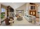 Bright living room with a stone fireplace, vaulted ceilings and stylish furniture at 6398 Lost Canyon Ranch Rd, Castle Rock, CO 80104