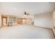 Open-concept living room with a dry bar and stairs at 6398 Lost Canyon Ranch Rd, Castle Rock, CO 80104