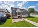 Well-maintained backyard with lush lawn, stone landscaping, a gas grill, and a white fence, perfect for outdoor gatherings at 1100 S Garfield St, Denver, CO 80210