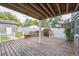 Spacious deck with wood floors, supported by white pillars, offering serene outdoor lounging and entertainment space at 1100 S Garfield St, Denver, CO 80210