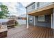 Outdoor deck with a view, brick and wood accents, bench seating, and a white picket fence surrounds the yard at 1100 S Garfield St, Denver, CO 80210