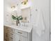 Bathroom featuring a double sink vanity, modern fixtures, and ample counter space at 1100 S Garfield St, Denver, CO 80210