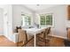 Dining area with ample natural light and cozy bench seating at 1100 S Garfield St, Denver, CO 80210