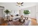 Bright living room with hardwood floors and a decorative rug at 1100 S Garfield St, Denver, CO 80210