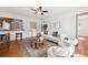 Cozy living room with wood floors and an open concept layout to kitchen at 1100 S Garfield St, Denver, CO 80210