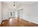 Open floor plan with hardwood floors, glass doors to the outside, and bright natural light at 1100 S Garfield St, Denver, CO 80210