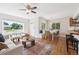 Open-concept layout with hardwood floors and views of front yard at 1100 S Garfield St, Denver, CO 80210