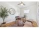 Home office includes a ceiling fan, hardwood floors, and a modern round mirror at 1100 S Garfield St, Denver, CO 80210