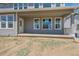 Covered back porch with ample space and potential for outdoor enjoyment at 4880 River Landing Ave, Firestone, CO 80504