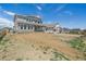 A view of the expansive backyard, showcasing the potential for landscaping and recreation at 4880 River Landing Ave, Firestone, CO 80504