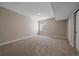 Unfinished basement area with carpet, window, and potential for customization at 4880 River Landing Ave, Firestone, CO 80504