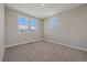 Simple bedroom with carpeted floors, trim and bright, natural light at 4880 River Landing Ave, Firestone, CO 80504