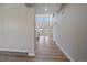 Bright entryway featuring high ceilings and elegant hardwood floors, leading into the home at 4880 River Landing Ave, Firestone, CO 80504