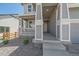 Inviting front porch with stylish columns, offering a welcoming entry to the home at 4880 River Landing Ave, Firestone, CO 80504