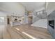 Open-concept living space connecting the kitchen, staircase, and living area for modern living at 4880 River Landing Ave, Firestone, CO 80504