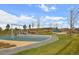 Community playground featuring a variety of recreational equipment and open space for children at 4880 River Landing Ave, Firestone, CO 80504