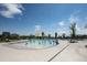 Community splash pool with fun water features, surrounded by plenty of space for lounging and recreation at 4880 River Landing Ave, Firestone, CO 80504