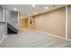View of finished basement featuring neutral carpet, recessed lights, and built-in shelving at 13030 King Cir, Broomfield, CO 80020