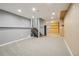 Spacious finished basement with neutral carpet, ample lighting, and convenient access stairs at 13030 King Cir, Broomfield, CO 80020