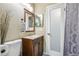 Well-lit bathroom featuring a vanity with ample storage and modern fixtures at 13030 King Cir, Broomfield, CO 80020