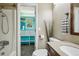 Bright bathroom featuring a walk-in closet with turquoise accents and a granite vanity at 13030 King Cir, Broomfield, CO 80020