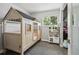 Playful bedroom features a house-shaped bed frame and a charming kitchenette play area at 13030 King Cir, Broomfield, CO 80020
