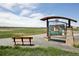Bench near informational signage about nature and local history in a serene outdoor setting at 13030 King Cir, Broomfield, CO 80020