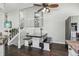 Open floor plan features a dining area with dark wood floors and stair access at 13030 King Cir, Broomfield, CO 80020