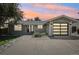 Charming single-story home with a modern garage door and drought resistant rock landscaping at 13030 King Cir, Broomfield, CO 80020