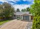 Charming single-story home with a modern garage door and drought resistant rock landscaping at 13030 King Cir, Broomfield, CO 80020