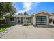 Charming single-story home with a modern garage door and drought resistant rock landscaping at 13030 King Cir, Broomfield, CO 80020