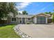 Charming single-story home with a modern garage door and drought resistant rock landscaping at 13030 King Cir, Broomfield, CO 80020