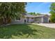 Well-maintained front yard with large tree shading the home and attractive rock landscaping at 13030 King Cir, Broomfield, CO 80020
